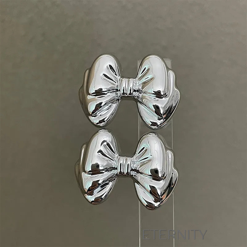 Zarcillos Moño Gloss  Zarcillos Dorado Unica Acero Inoxidable  ETERNITY