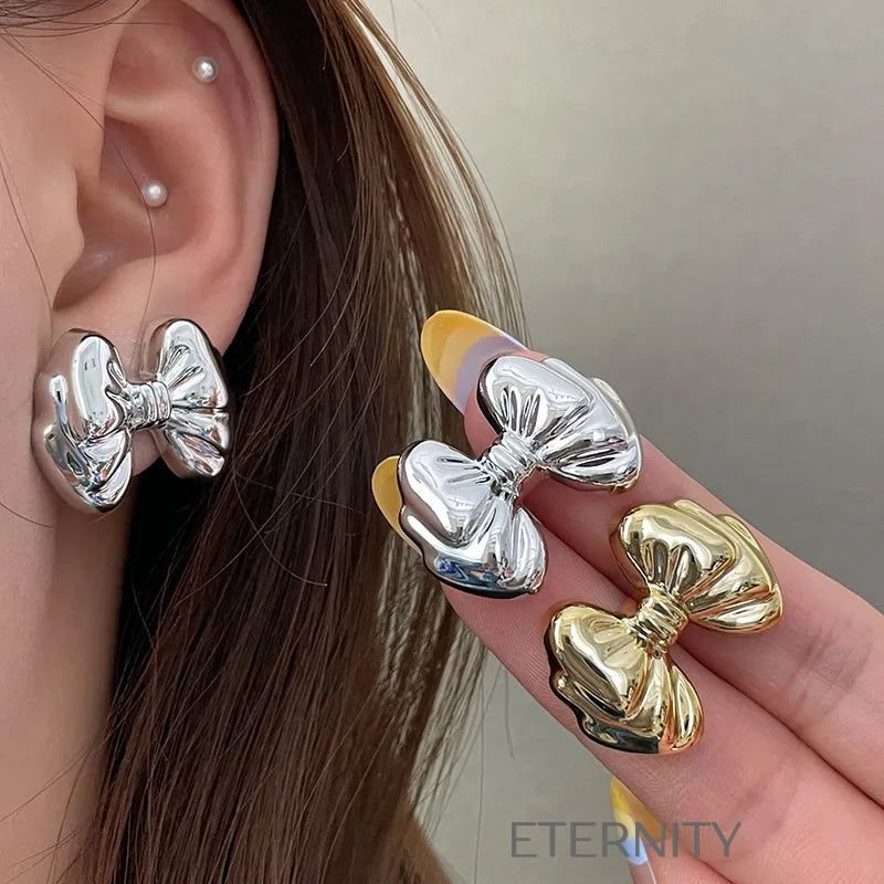 Zarcillos Moño Gloss  Zarcillos Dorado Unica Acero Inoxidable  ETERNITY