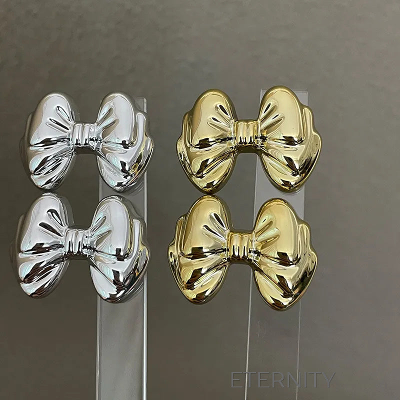 Zarcillos Moño Gloss  Zarcillos Dorado Unica Acero Inoxidable  ETERNITY