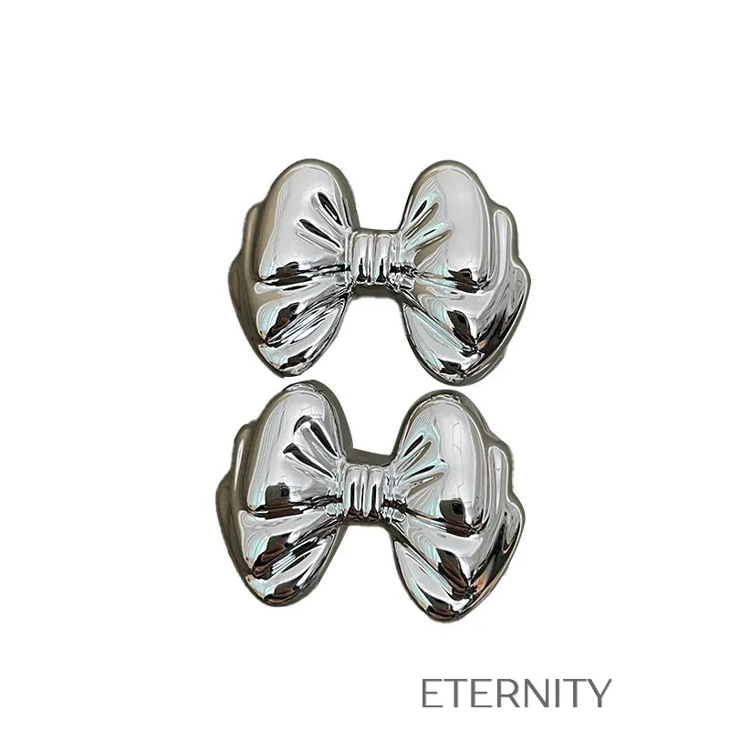 Zarcillos Moño Gloss  Zarcillos Dorado Unica Acero Inoxidable  ETERNITY