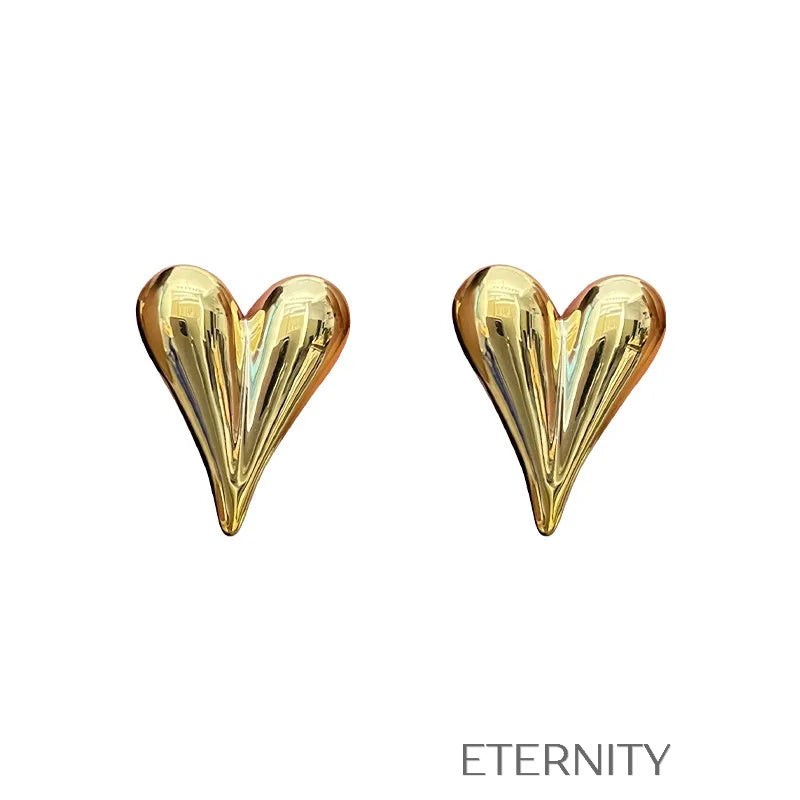 Zarcillos Puffy Heart de Botón con Diseño de Corazón Alargado en Oro y Plata  Zarcillos Dorado Unica Acero Inoxidable  ETERNITY