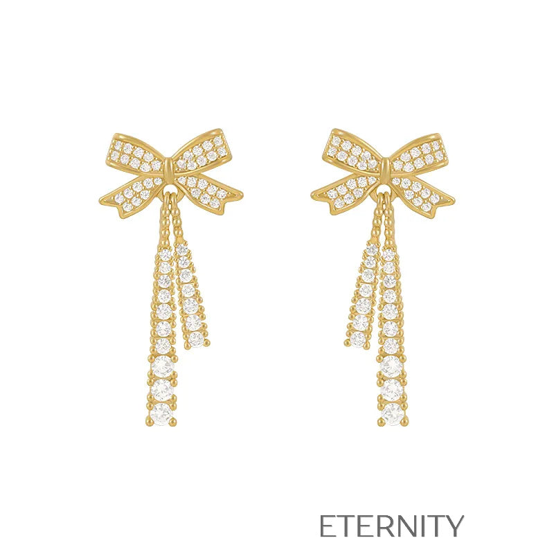 Zarcillos Colgantes Sparkle Bow con Cristales Pavé y Diseño de Lazo  Zarcillos Dorado Unica Acero Inoxidable  ETERNITY