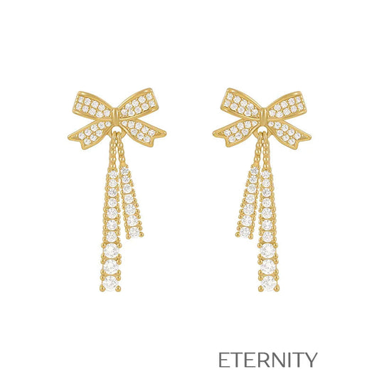 Zarcillos Colgantes Sparkle Bow con Cristales Pavé y Diseño de Lazo  Zarcillos Dorado Unica Acero Inoxidable  ETERNITY