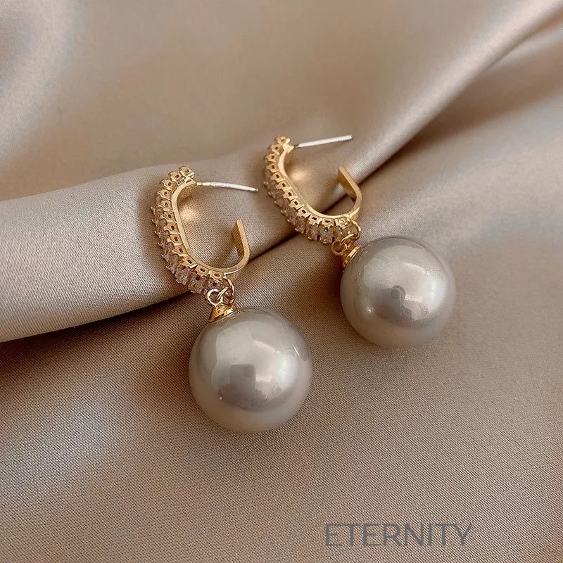 Zarcillos Nacre Sparkle con Perlas  Zarcillos Champagne Perla Unica Acero Inoxidable  ETERNITY