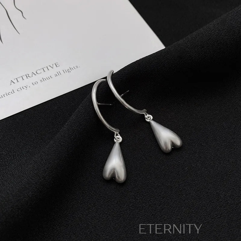 Zarcillos Liquid Heart en Gold y Silver  Zarcillos Dorado Unica Acero Inoxidable  ETERNITY