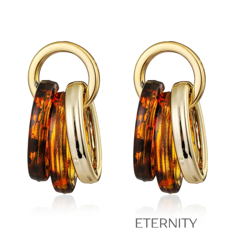 Zarcillos de Aros Entrelazados en Oro y Resina Carey  Zarcillos Dorado Unica Acero Inoxidable  ETERNITY
