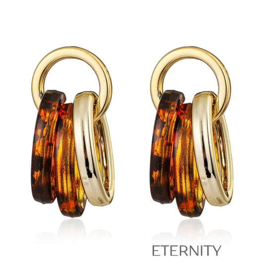Zarcillos de Aros Entrelazados en Oro y Resina Carey  Zarcillos Dorado Unica Acero Inoxidable  ETERNITY