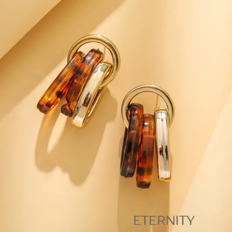 Zarcillos de Aros Entrelazados en Oro y Resina Carey  Zarcillos Dorado Unica Acero Inoxidable  ETERNITY