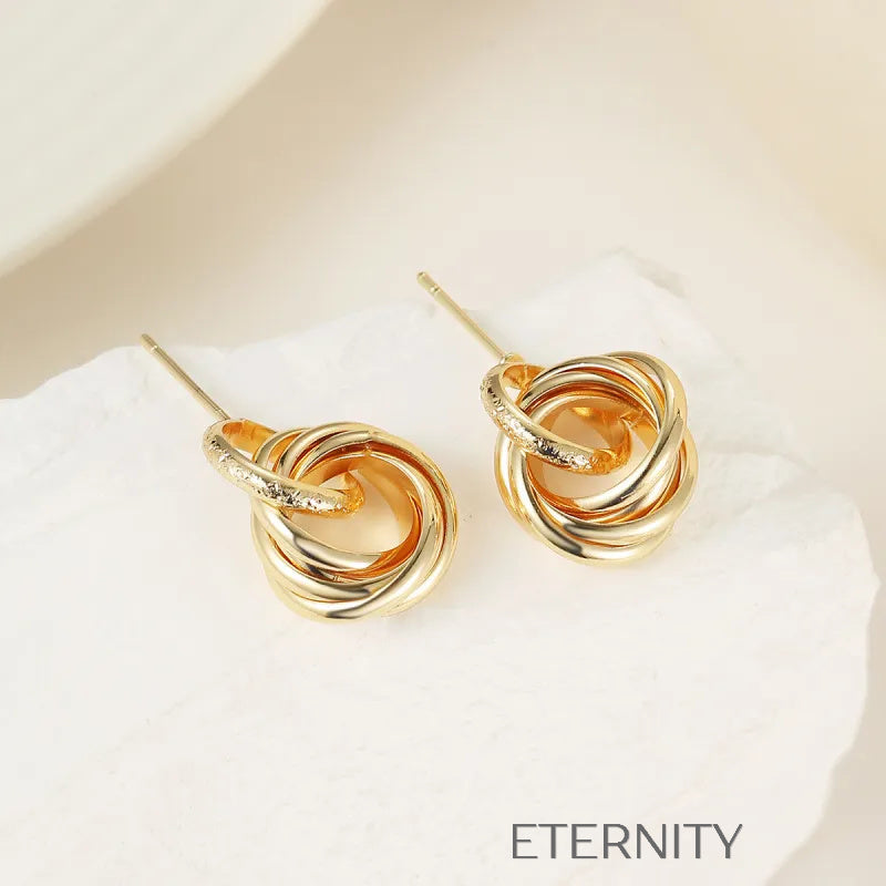 Zarcillos de Botón Nudo de Oro Entrelazado  Zarcillos Dorado Unica Acero Inoxidable  ETERNITY