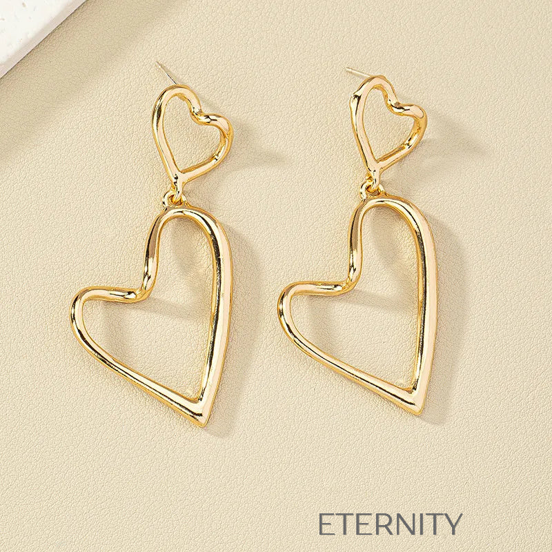 Zarcillos Colgantes de Doble Corazón Eternal Love en Oro  Zarcillos Dorado Unica Acero Inoxidable  ETERNITY