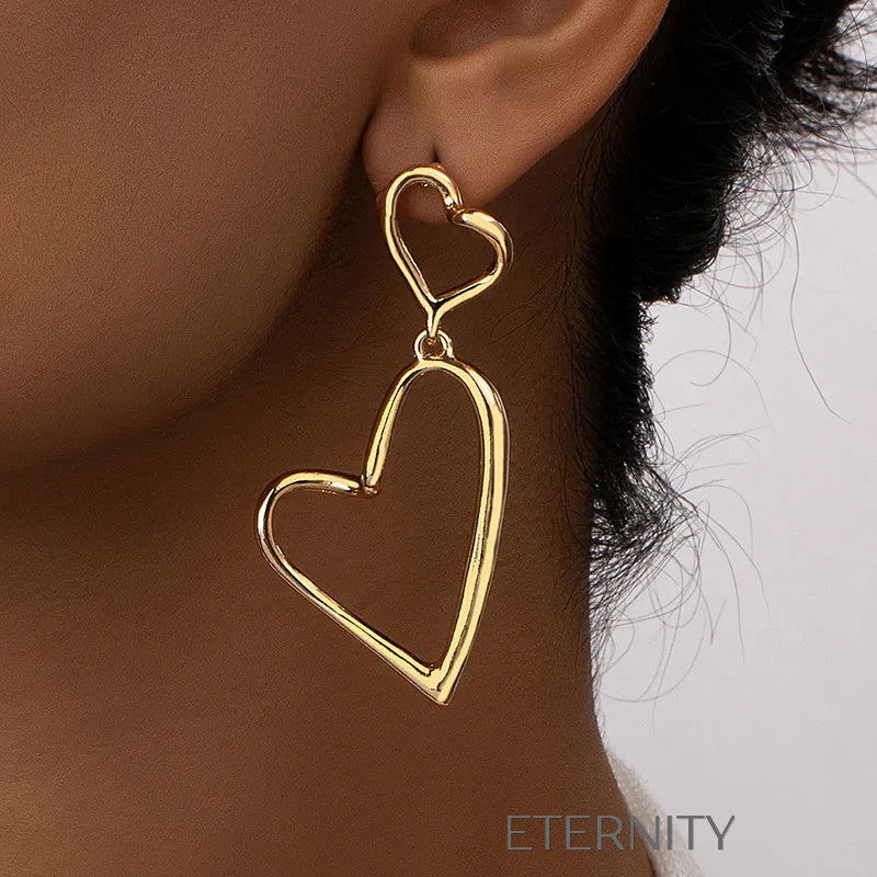 Zarcillos Colgantes de Doble Corazón Eternal Love en Oro  Zarcillos Dorado Unica Acero Inoxidable  ETERNITY