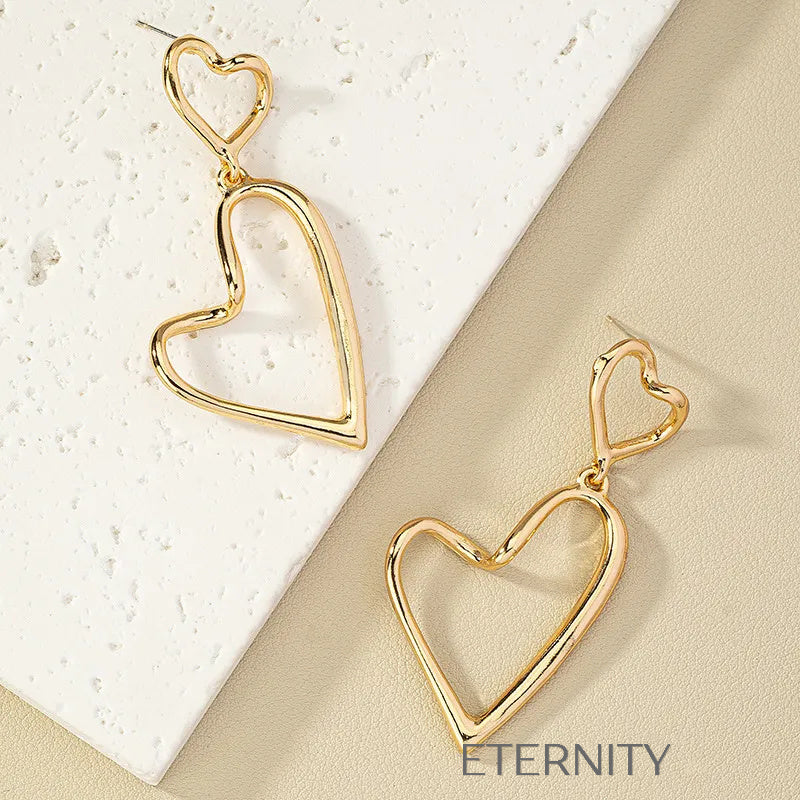 Zarcillos Colgantes de Doble Corazón Eternal Love en Oro  Zarcillos Dorado Unica Acero Inoxidable  ETERNITY