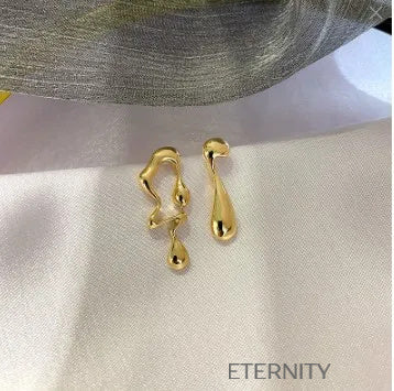 Zarcillos de Metal Líquido Orgánico en Oro y Plata  Zarcillos Dorado Unica Acero Inoxidable  ETERNITY