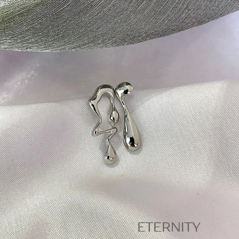 Zarcillos de Metal Líquido Orgánico en Oro y Plata  Zarcillos Dorado Unica Acero Inoxidable  ETERNITY