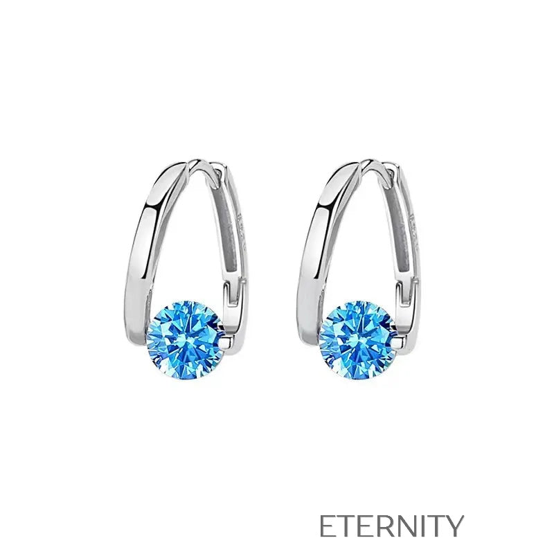 Zarcillos Solitaire Aura de Aro Estilizado con Cristal Central en Oro y Plata  Zarcillos Dorado Unica Acero Inoxidable  ETERNITY