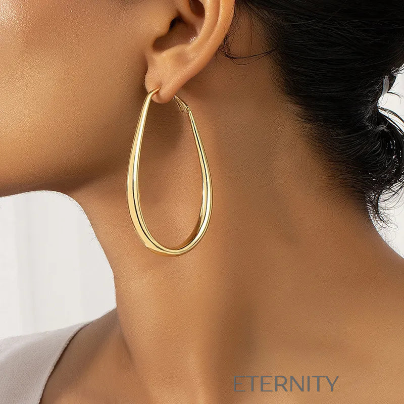 Zarcillos Oval Essence  Zarcillos Dorado Unica Acero Inoxidable  ETERNITY