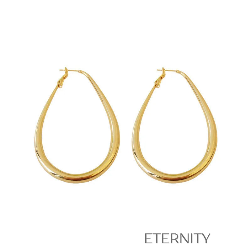 Zarcillos Oval Essence  Zarcillos Dorado Unica Acero Inoxidable  ETERNITY
