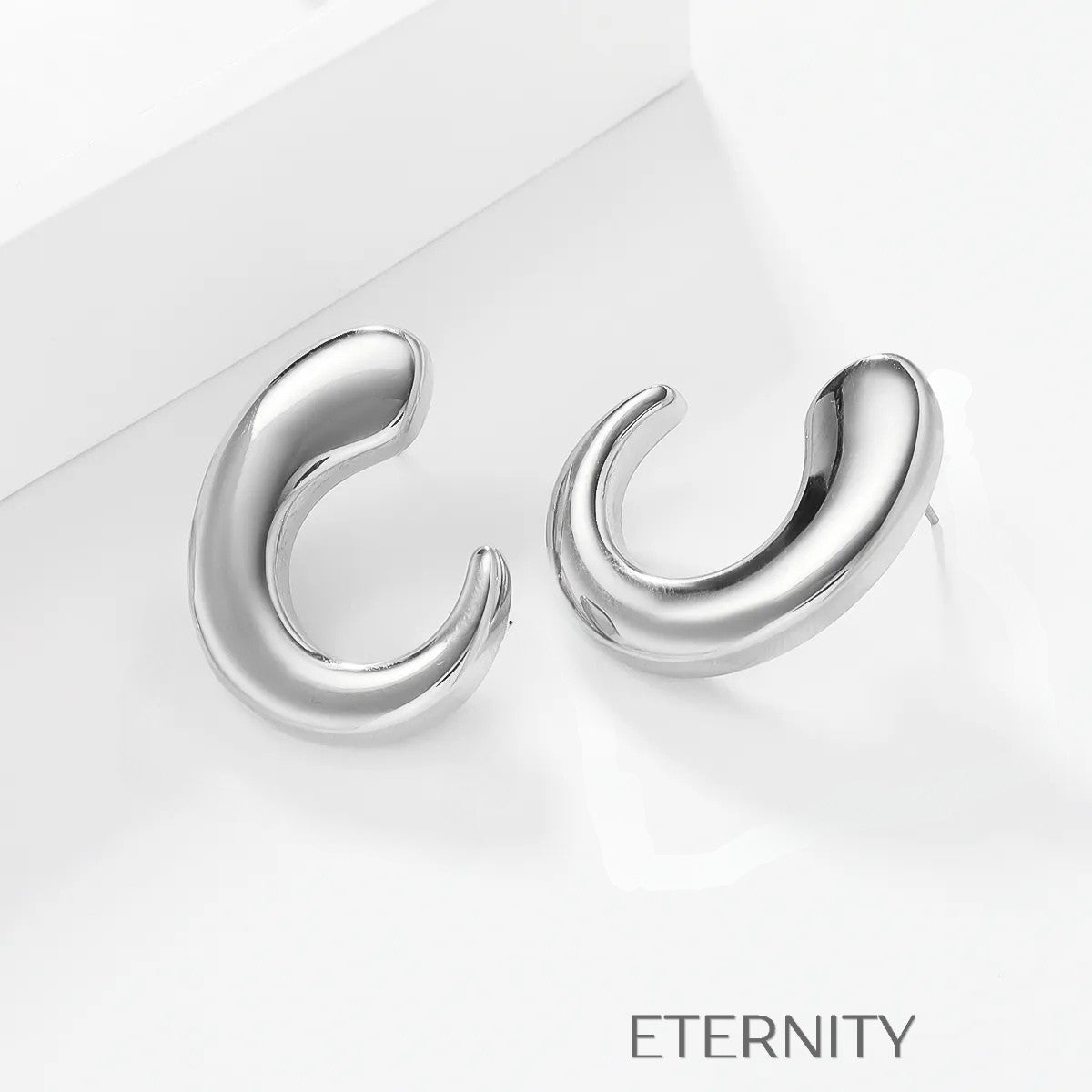 Zarcillos de Aro Fluid Crescent con Diseño Orgánico y Ergonómico  Zarcillos Dorado Unica Acero Inoxidable  ETERNITY