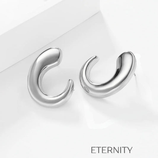 Zarcillos de Aro Fluid Crescent con Diseño Orgánico y Ergonómico  Zarcillos Dorado Unica Acero Inoxidable  ETERNITY