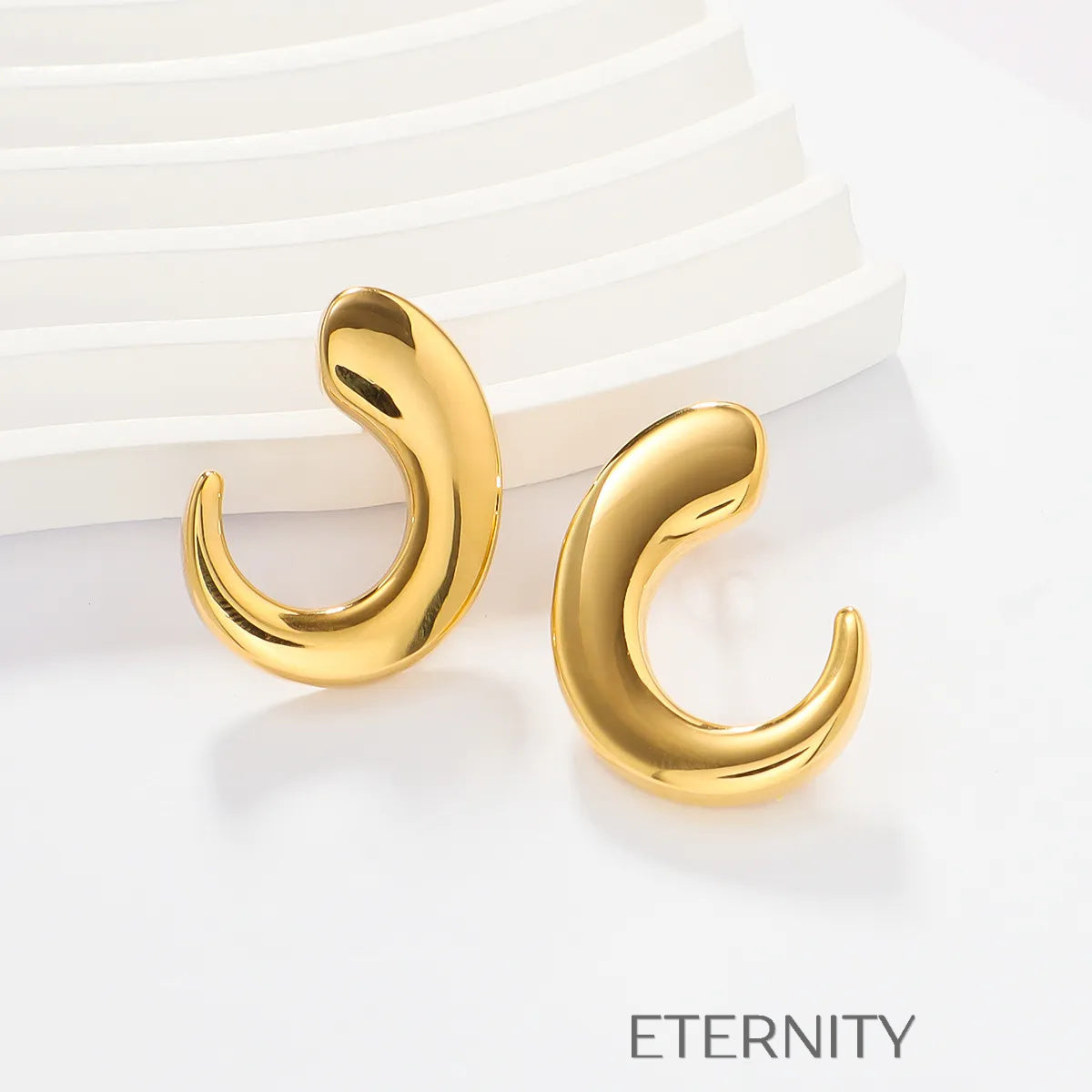 Zarcillos de Aro Fluid Crescent con Diseño Orgánico y Ergonómico  Zarcillos Dorado Unica Acero Inoxidable  ETERNITY
