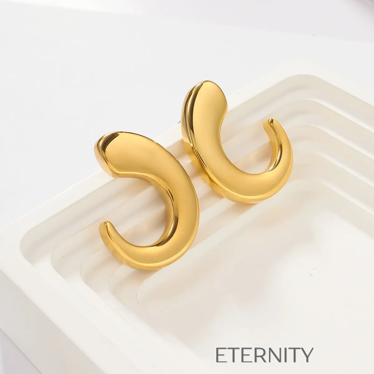 Zarcillos de Aro Fluid Crescent con Diseño Orgánico y Ergonómico  Zarcillos Dorado Unica Acero Inoxidable  ETERNITY