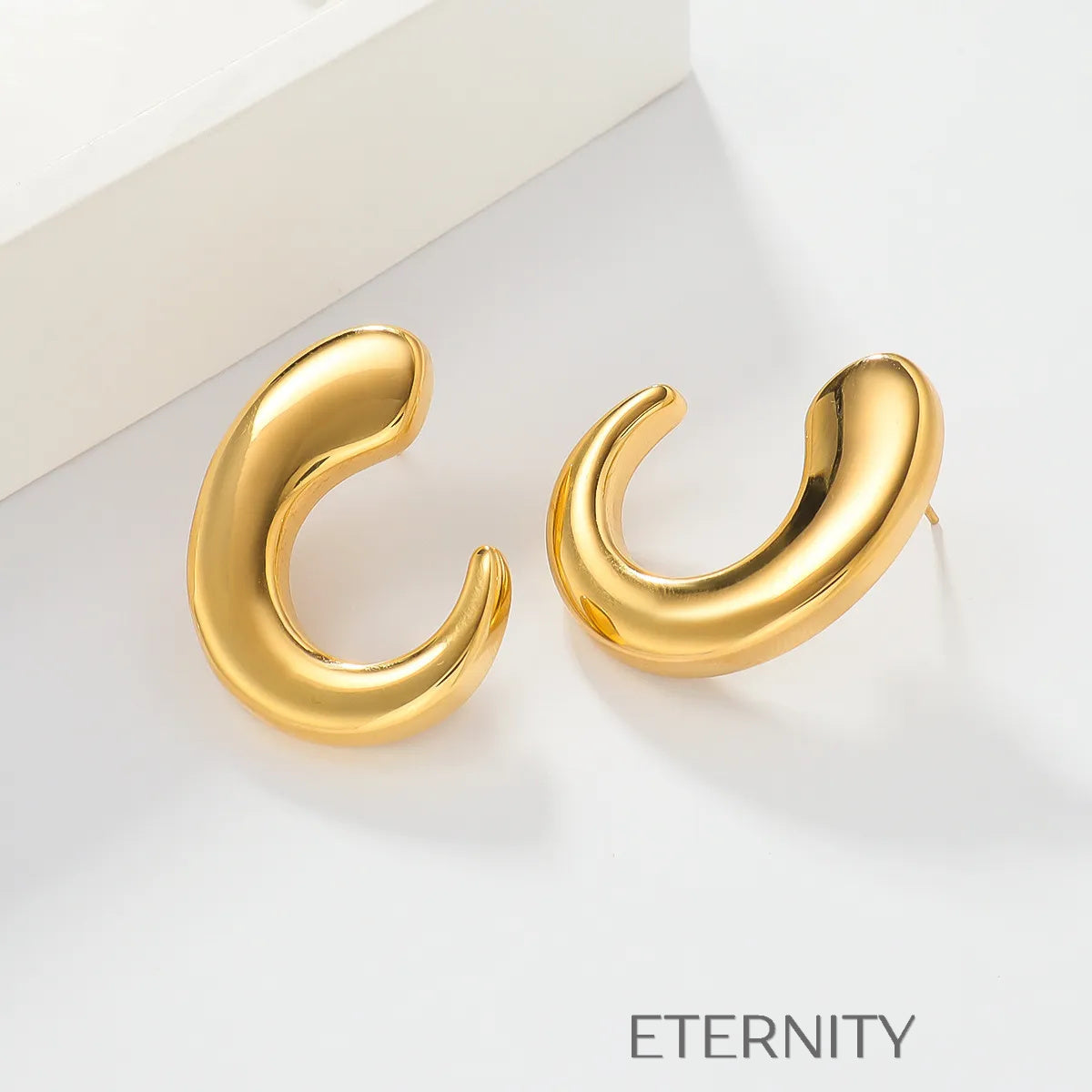 Zarcillos de Aro Fluid Crescent con Diseño Orgánico y Ergonómico  Zarcillos Dorado Unica Acero Inoxidable  ETERNITY