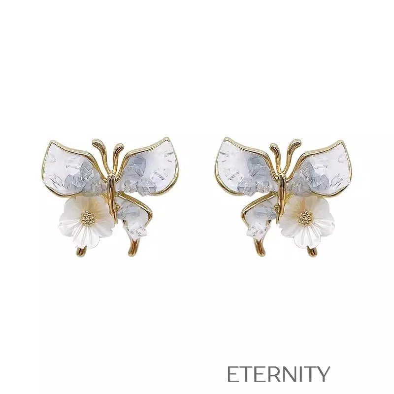 Zarcillos de Mariposa con Efecto Nácar y Flor Central  Zarcillos Azul Unica Acero Inoxidable  ETERNITY