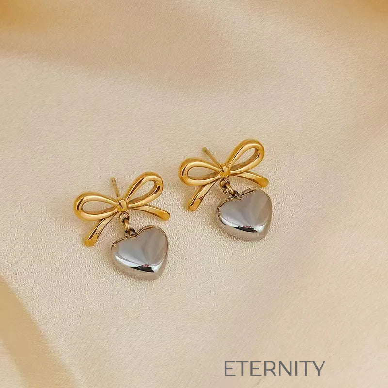 Zarcillos Luxe Ribbon Heart con Diseño de Lazo y Dije de Corazón en Oro  Zarcillos Dorado Unica Acero Inoxidable  ETERNITY