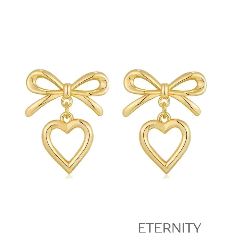 Zarcillos Luxe Ribbon Heart con Diseño de Lazo y Dije de Corazón en Oro  Zarcillos Dorado Unica Acero Inoxidable  ETERNITY