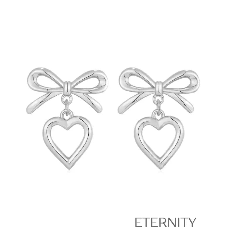 Zarcillos Luxe Ribbon Heart con Diseño de Lazo y Dije de Corazón en Oro  Zarcillos Dorado Unica Acero Inoxidable  ETERNITY