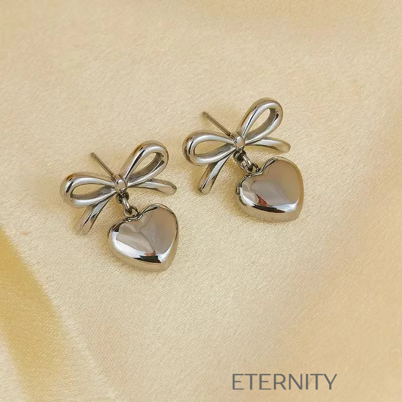 Zarcillos Luxe Ribbon Heart con Diseño de Lazo y Dije de Corazón en Oro  Zarcillos Dorado Unica Acero Inoxidable  ETERNITY