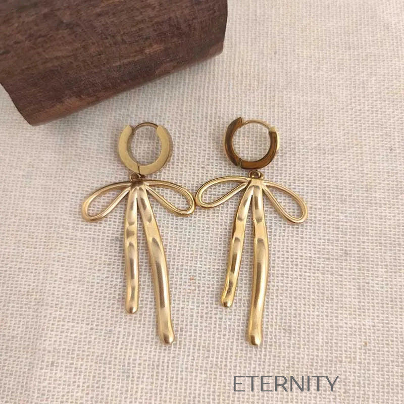Zarcillos Textured Bow Hoops con Dije de Lazo Orgánico en Oro y Plata  Zarcillos Dorado Unica Acero Inoxidable  ETERNITY