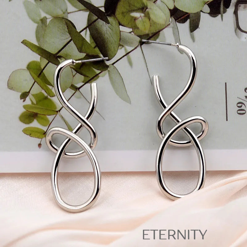 Aretes dorados y plateados con diseño abstracto entrelazado Zarcillos Dorado Unica Acero Inoxidable  ETERNITY