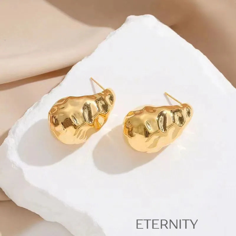 Zarcillos Liquid Metal Diseño Orgánico  Zarcillos Dorado Unica Acero Inoxidable  ETERNITY