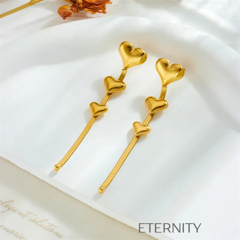 Zarcillos Largos Luminous Heart con Cascada de Corazones y Cadena Plana  Zarcillos Dorado Unica Acero Inoxidable  ETERNITY
