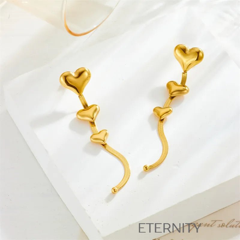Zarcillos Largos Luminous Heart con Cascada de Corazones y Cadena Plana  Zarcillos Dorado Unica Acero Inoxidable  ETERNITY