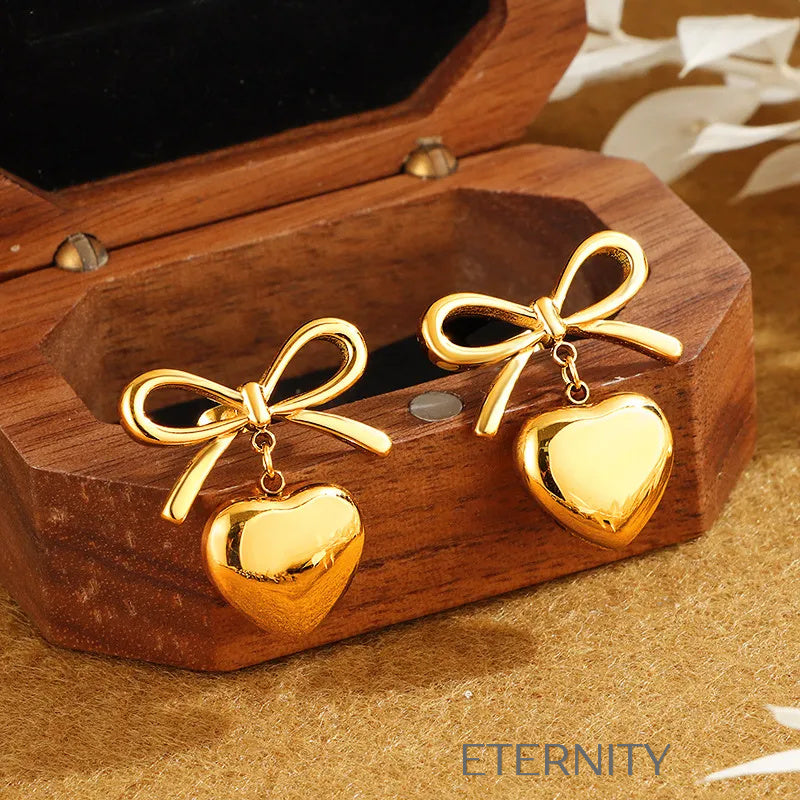 Zarcillos Coquette Heart de Lazo y Corazón  Zarcillos Dorado Unica Acero Inoxidable  ETERNITY