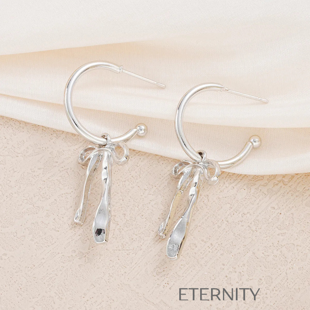 Aretes con lazo y colgantes texturizados Zarcillos Dorado Unica Acero Inoxidable  ETERNITY