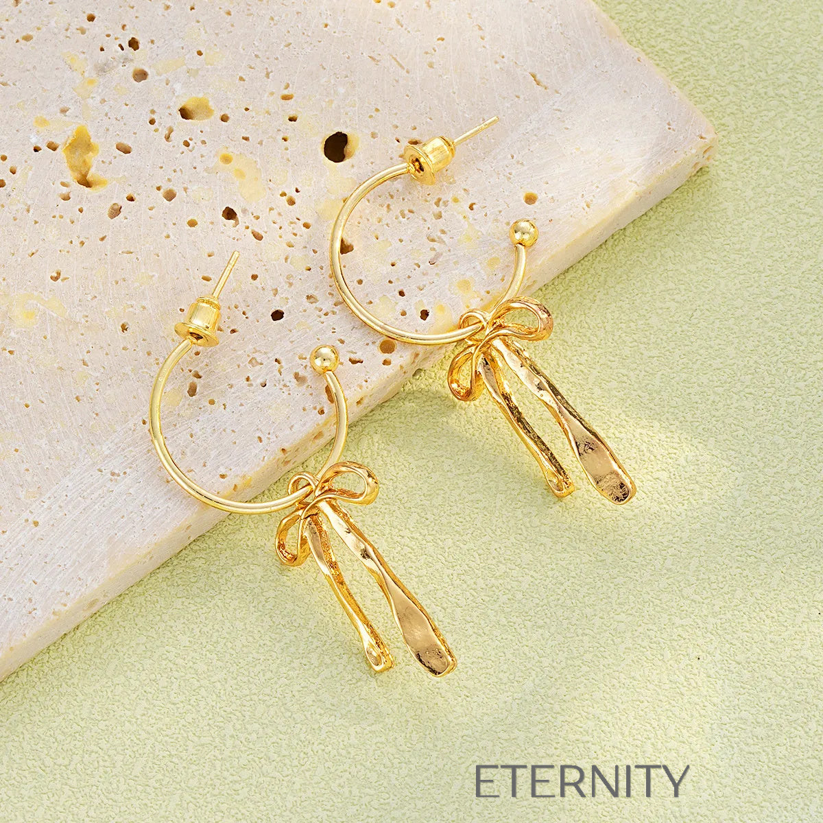 Aretes con lazo y colgantes texturizados Zarcillos Dorado Unica Acero Inoxidable  ETERNITY