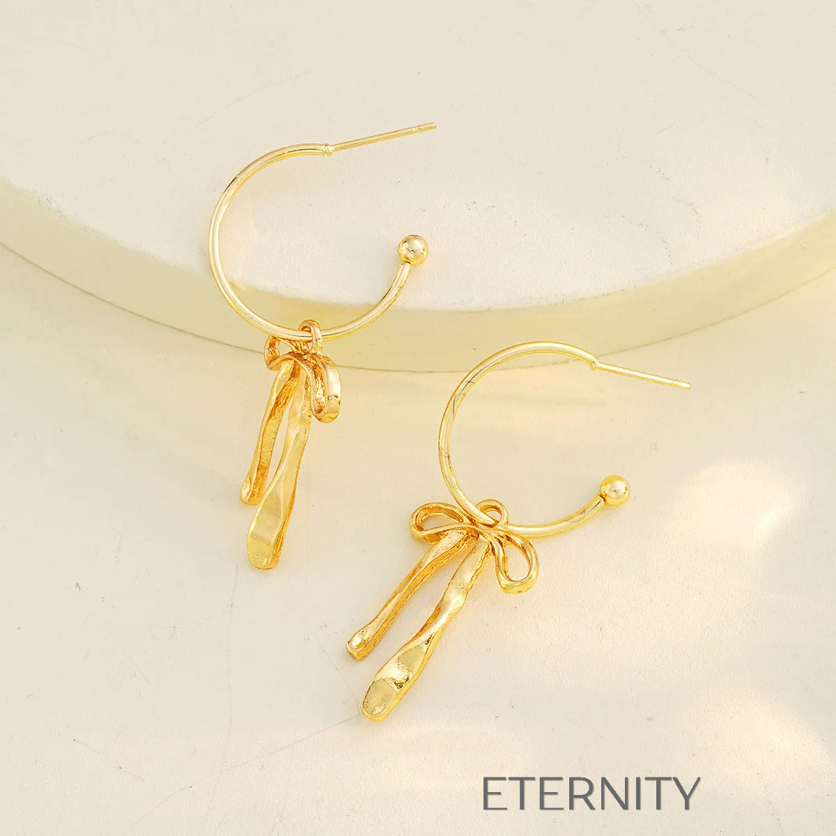 Aretes con lazo y colgantes texturizados Zarcillos Dorado Unica Acero Inoxidable  ETERNITY