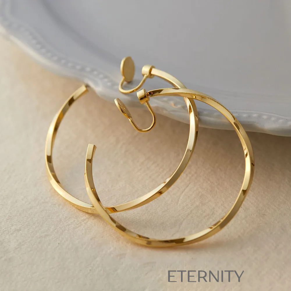 Aretes dorados y plateados con diseño moderno y elegante Zarcillos Dorado 40mm Acero Inoxidable  ETERNITY