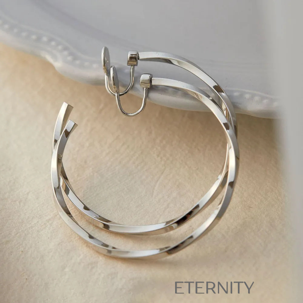 Aretes dorados y plateados con diseño moderno y elegante Zarcillos Dorado 40mm Acero Inoxidable  ETERNITY