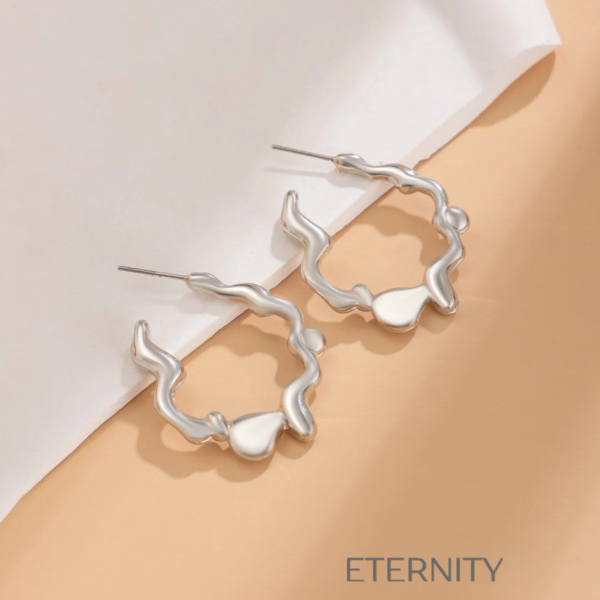 Aretes dorados y plateados con diseño artístico y moderno Zarcillos Dorado Unica Acero Inoxidable  ETERNITY