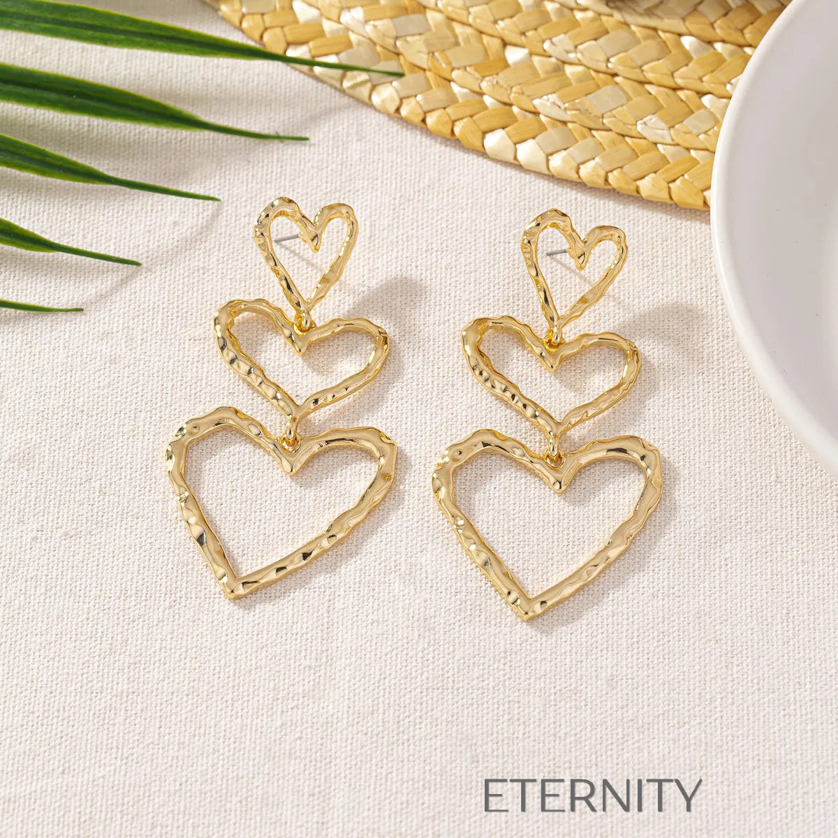 Zarcillos Triple Heart en Cascada de Oro  Zarcillos Dorado Unica Acero Inoxidable  ETERNITY
