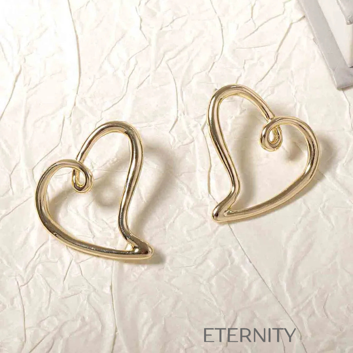Zarcillo Liquid Heart Estilizado  Zarcillos Dorado Unica Acero Inoxidable  ETERNITY