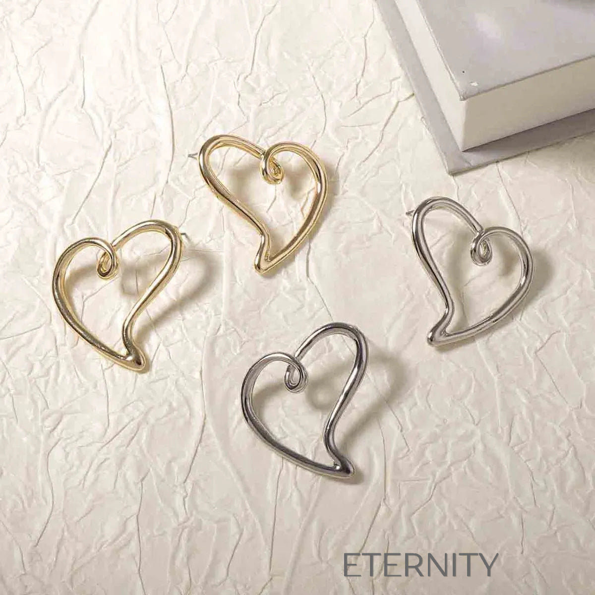 Zarcillo Liquid Heart Estilizado  Zarcillos Dorado Unica Acero Inoxidable  ETERNITY