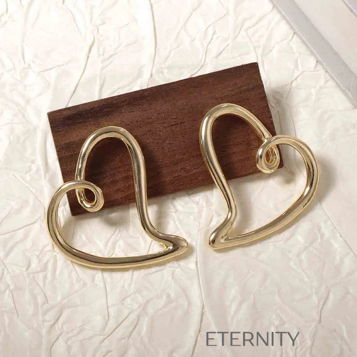 Zarcillo Liquid Heart Estilizado  Zarcillos Dorado Unica Acero Inoxidable  ETERNITY