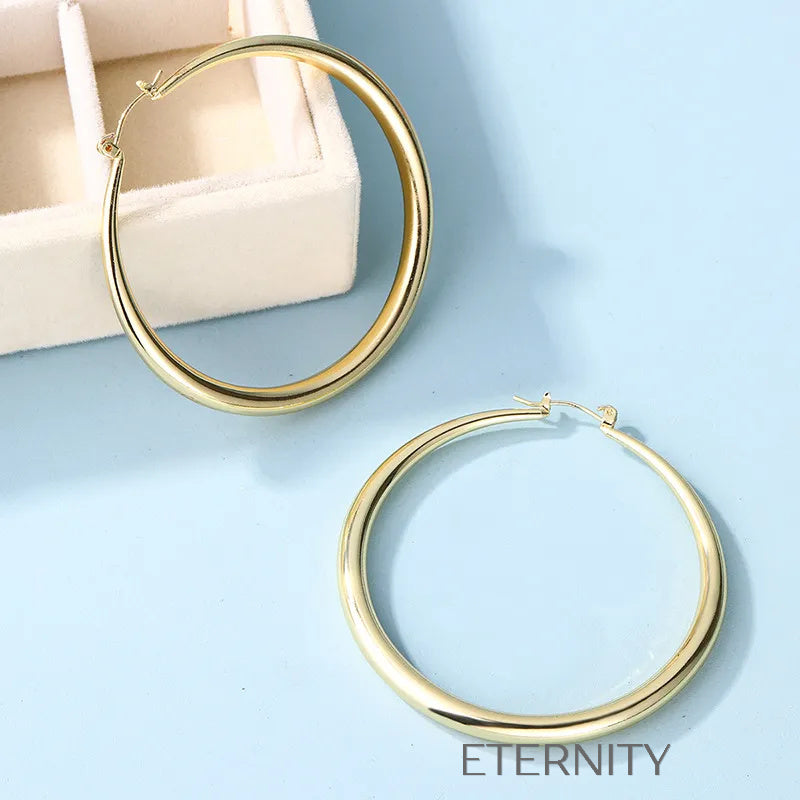 Argollas Infinite Shine de Gran Formato  Zarcillos Dorado Unica Acero Inoxidable  ETERNITY