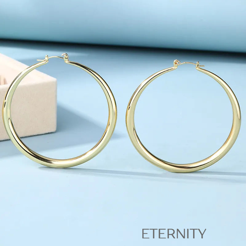 Argollas Infinite Shine de Gran Formato  Zarcillos Dorado Unica Acero Inoxidable  ETERNITY