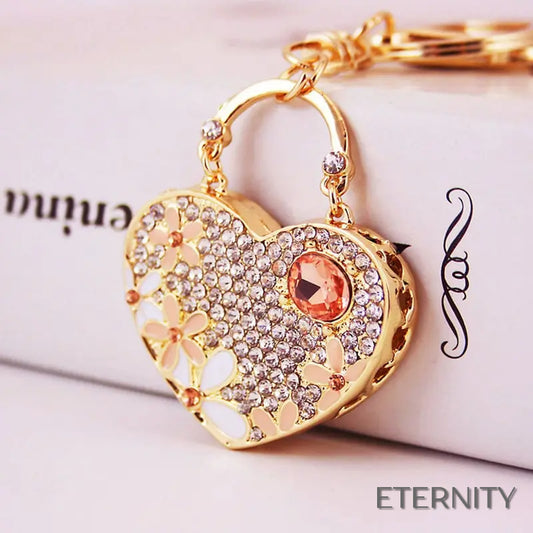 Llavero Dorado con Corazón Brillante, Flores Esmaltadas y Gemas - ETERNITY